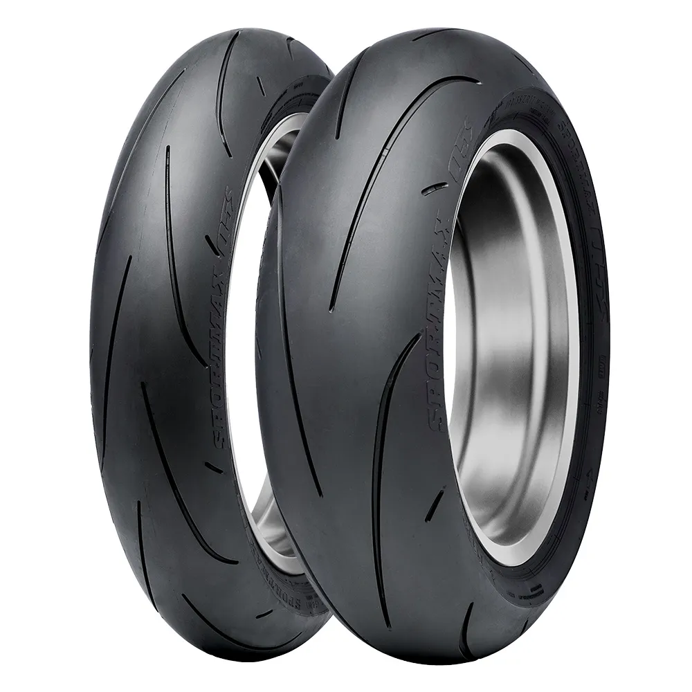 A pair of motorcycle hypersport tyres on a white background