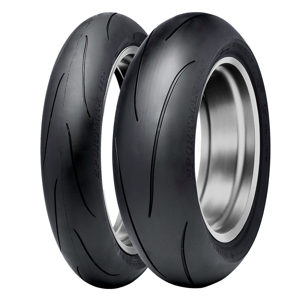 A pair of motorcycle hypersport tyres on a white background