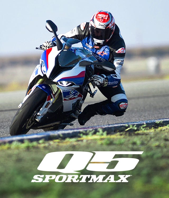Image of race track rider on a motorcycle